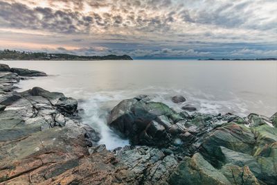 Dancing clouds over a quiet bay