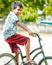 Happy boy riding bicycle