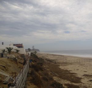 Scenic view of sea against cloudy sky