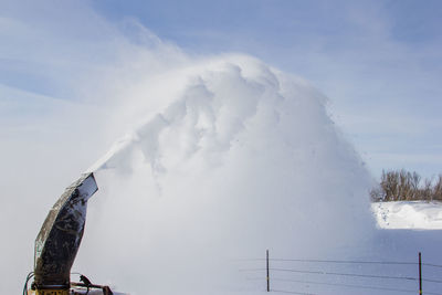 Low angle view of snowcapped mountain against sky