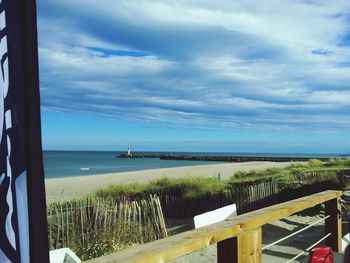 Scenic view of sea against cloudy sky
