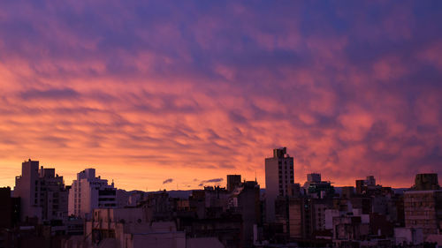 Cityscape against sky during sunset