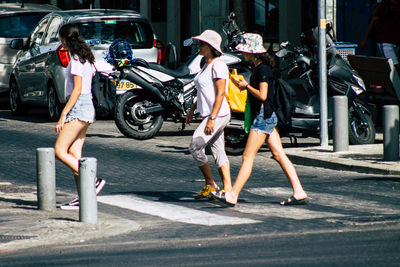 People walking on road in city