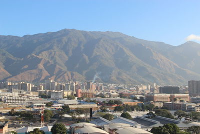 View of cityscape against mountains