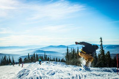 People skiing on snowcapped mountain