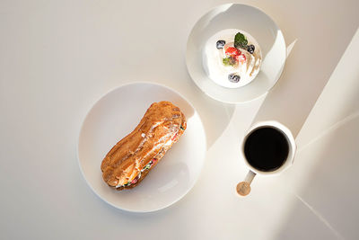 Sweet desserts with strawberry, blueberry and mint on white table. continental breakfast 