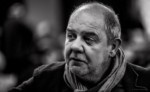 Portrait of a man looking away outdoors