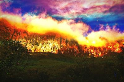 Scenic view of landscape against cloudy sky