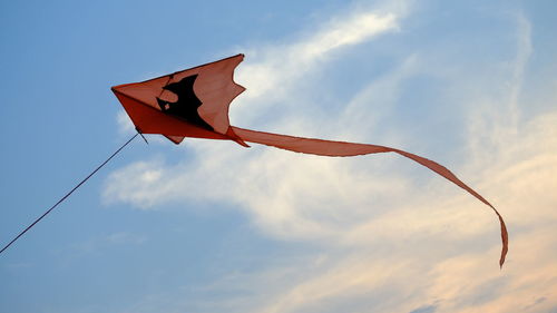 Low angle view of flags hanging against sky