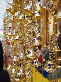 Close-up of wind chime hanging for sale at market