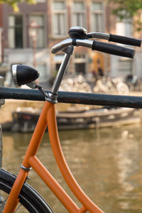 Close-up of bicycle handlebars on a railing