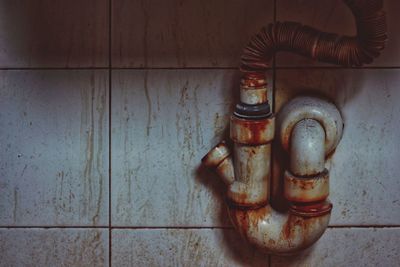 Close-up of rusty pipe on wall