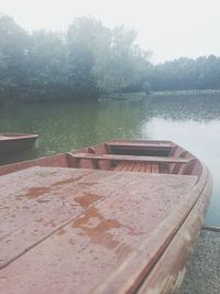 Calm lake with trees in background