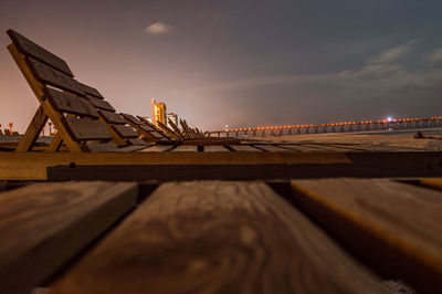 Low angle view of bridge over pier against sky during sunset