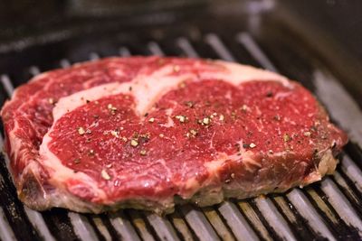 Close-up of meat on barbecue grill