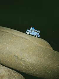 High angle view of toy car on rock
