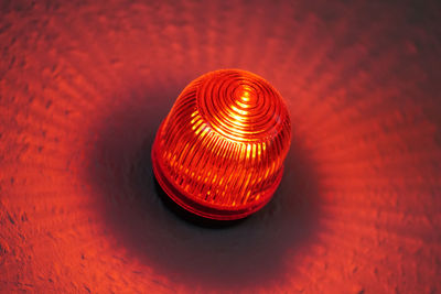 High angle view of illuminated electric lamp on table