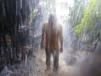 Full length of woman standing in water