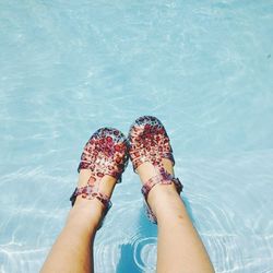 Low section of woman in water