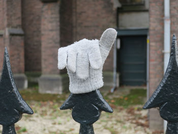 Side view of person standing against sculpture