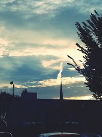 Low angle view of silhouette buildings against sky during sunset