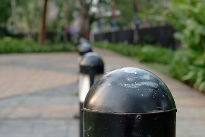 Close-up of old metal on street