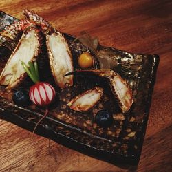 High angle view of fruits in plate on table