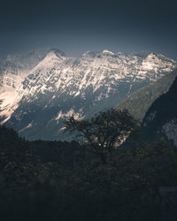 Scenic view of snowcapped mountains against sky