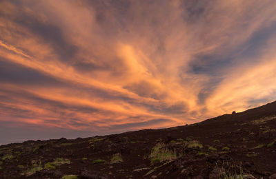 Scenic view of dramatic sky during sunset