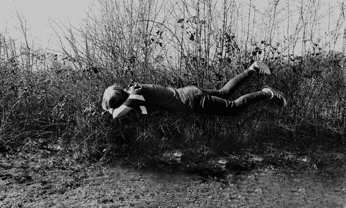 Full length of man lying on field