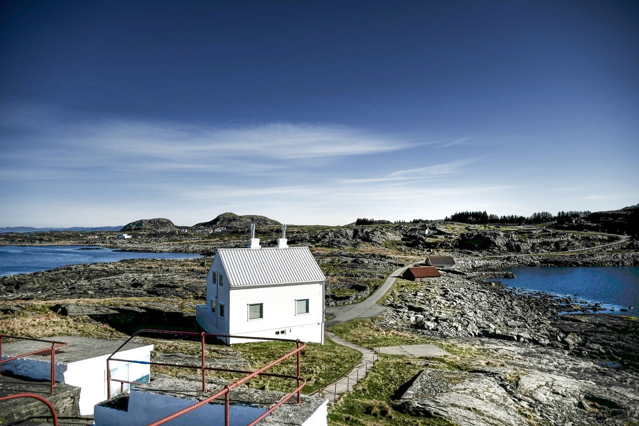 BUILDING BY SEA AGAINST SKY