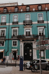 Street by buildings in city