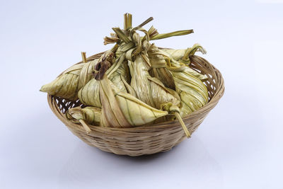 High angle view of wicker basket on white background