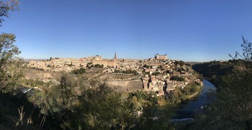 Panoramic view of building against clear blue sky