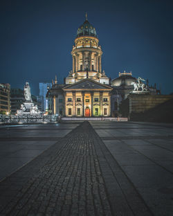 View of illuminated building against sky at night