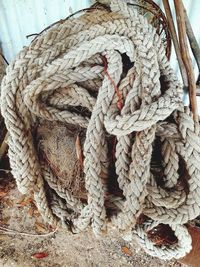 Close-up of rope tied on wood