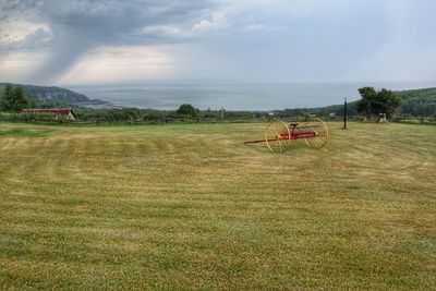 Scenic view of landscape against cloudy sky