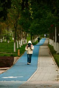 Rear view of man walking on street