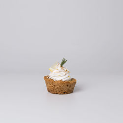 Close-up of cake against white background