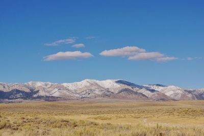 Scenic view of landscape and mountains against sky