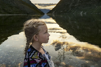 Portrait of girl looking at lake