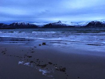 Scenic view of sea against sky during winter