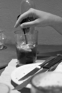 Woman drinking glass on table