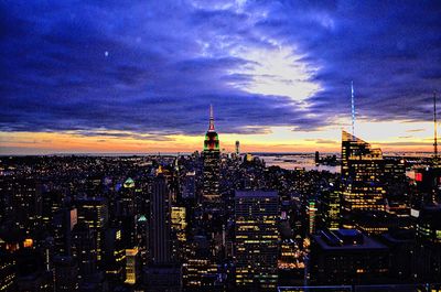 Aerial view of city lit up at night