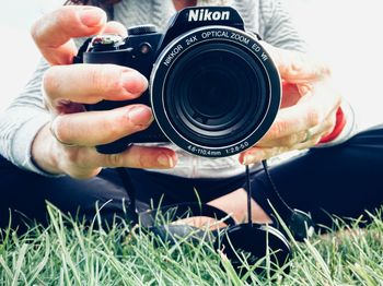 Close-up of hand holding camera