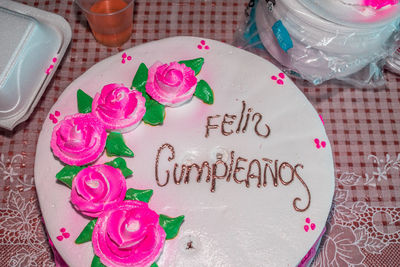 High angle view of pink cake on table