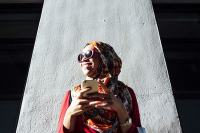 Young woman using smart phone