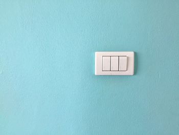 Close-up of electric light on wall