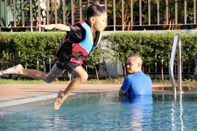 Young woman playing in water