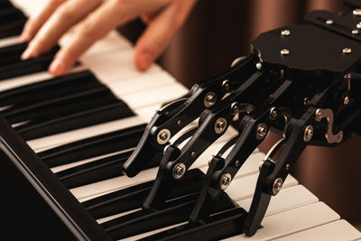 Human with neural hand prosthesis playing piano